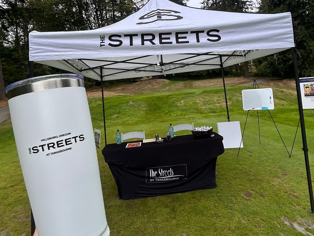 Golf tournament. Shade tent and custom branded coffee mug